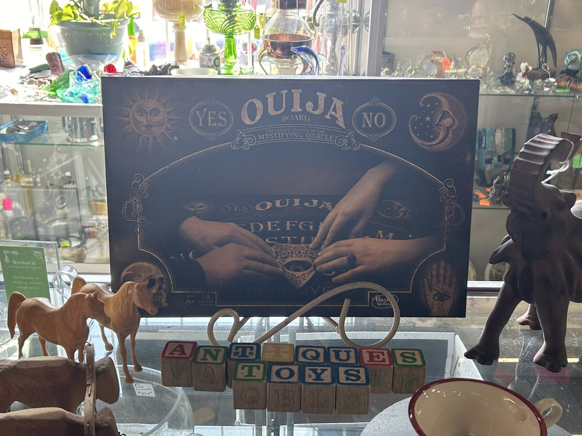 should i buy the vintage ouiji board from the antique store. to further the plot