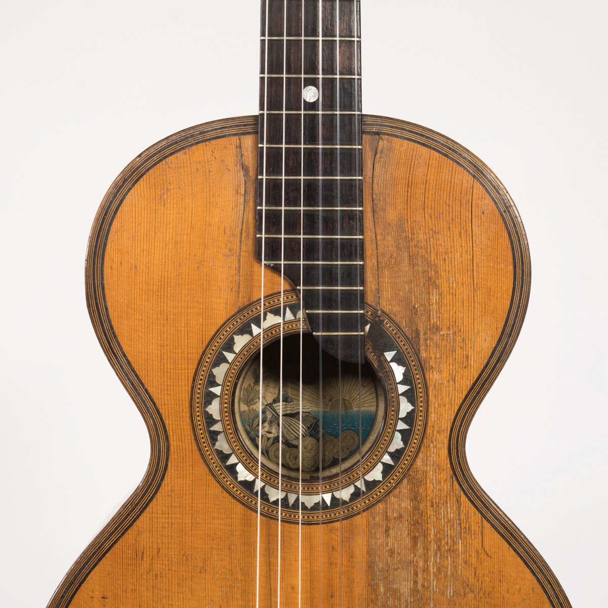 New install! ⭐ April’s acquisition of the month is this well-loved parlor guitar made during the turn of the twentieth century. This guitar, made of birdseye maple, spruce, and pine, was played in Chile for most of its life.
