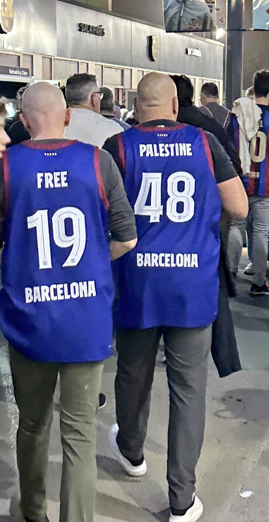 Two fans wore tops with 'Free Palestine' written on them at a basketball game between Spanish team FC Barcelona and Israeli team Maccabi Tel Aviv in which the Palestine flag was banned.