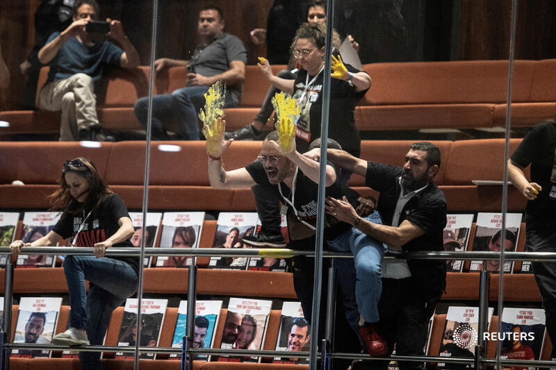 Families and supporters of hostages kidnapped during the October 7 attack on Israel smear yellow paint on glass above the plenum as part of a demonstration at the Knesset in Jerusalem. More photos of the week: reut.rs/3U6zzuY 📷 Oren Ben Hakoon