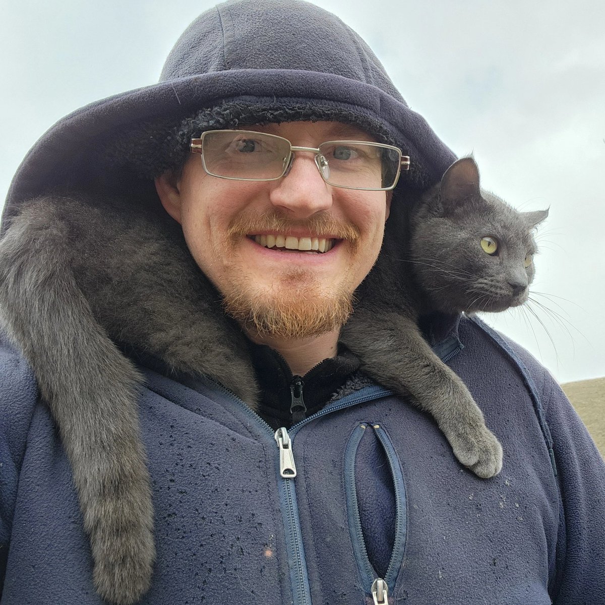 He stays dry and my neck stays warm.