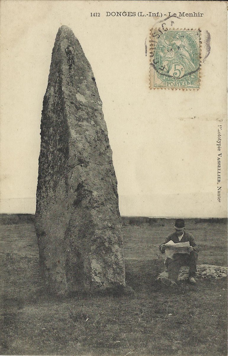 In 1905 the 4.75m tall needle-like menhir of La Vacherie in Donges (Loire-Atlantique) was in open countryside with a convenient rock next to it on which you could sit and read your paper. It was subsequently engulfed by an oil refinery. #StandingStoneSunday.
