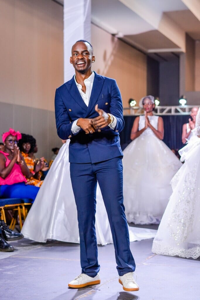 Zimbabwean designer Molefe Mleye closing his collection. The white wedding dress tradition dates back to the 19th century, when Queen Victoria broke with tradition and wore a white gown for her wedding to Prince Albert. #FashionTraditions #Runway #FashionElegance #BridalFashion