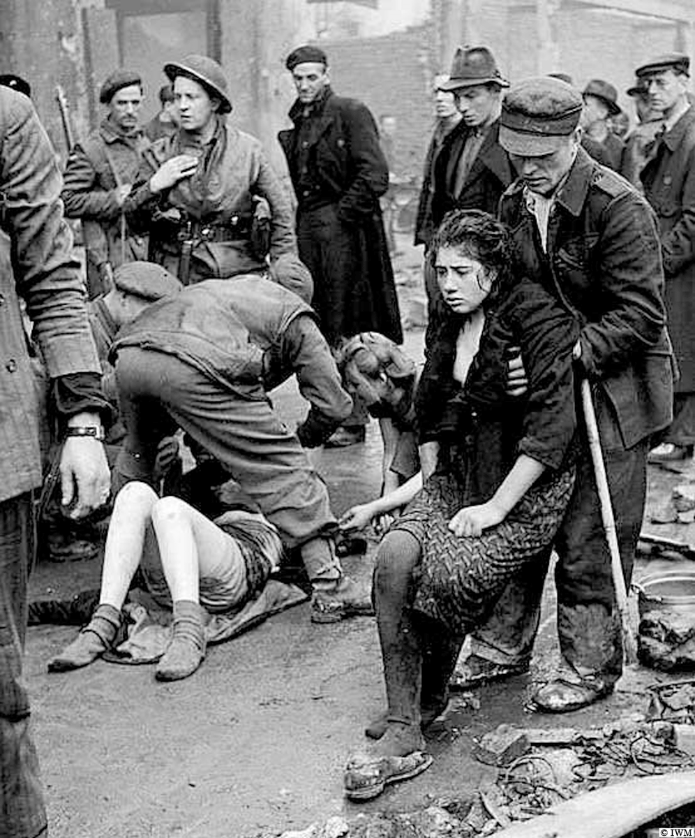 Lucky escape. (#OTD in 1945, Osnabrück, Germany. Liberated Soviet slave workers being rescued from a cellar after it had been set on fire. #WW2 #HISTORY)