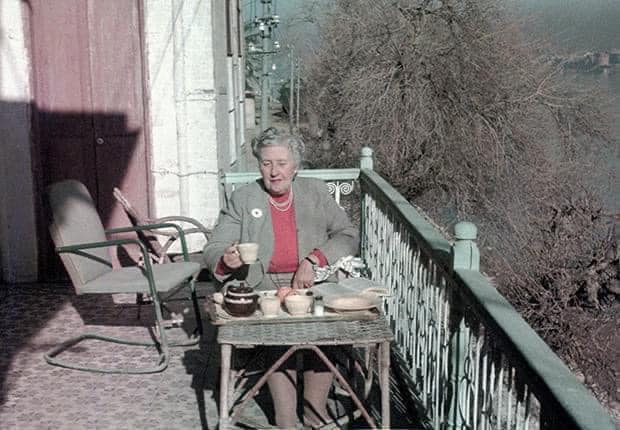Agatha Christie enjoying tea on the balcony of the British School of Archaeology in Iraq, Baghdad, 1950s. Image Credit: © The Christie Archive Trust