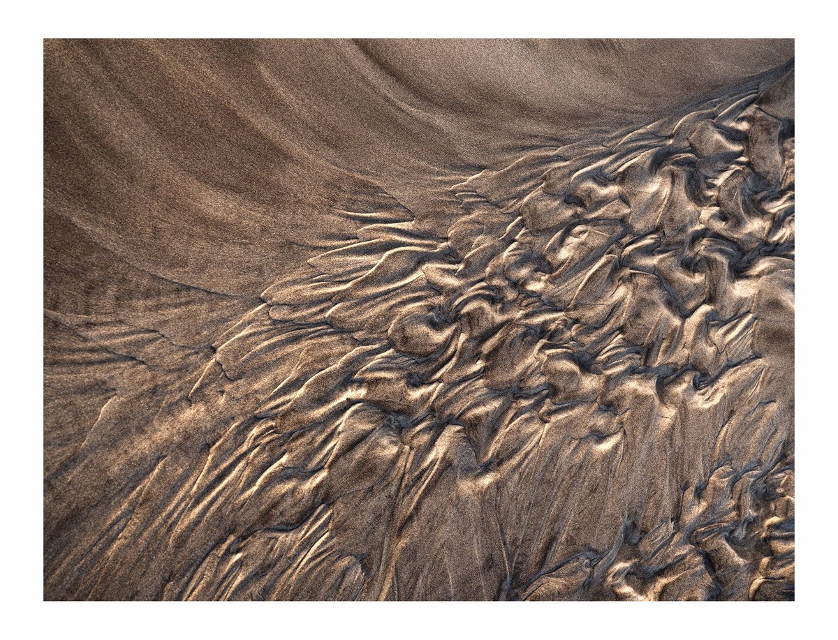 Recently spent a lovely week on the coast. In between the wild rain and wind had some wonderful light showing the shapes in these miniature sand estuaries.