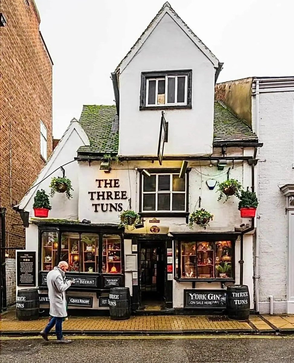 Three Tuns Pub; Coppergate, City Centre of York, England. The building was probably constructed in the 16th Century AD, and is timber-framed, with the first floor jettied. It was heavily altered in 19th Century AD, since when it has been a two-storey building with an attic, and