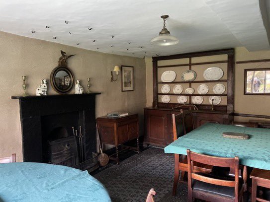 Just noticed that in this photo of the front room in Beatrix Potter’s Yew Tree Farm, you can see the ghost of a gardening Mr McGregor reflected in the pic on the wall on the right! (Enlargement needed).