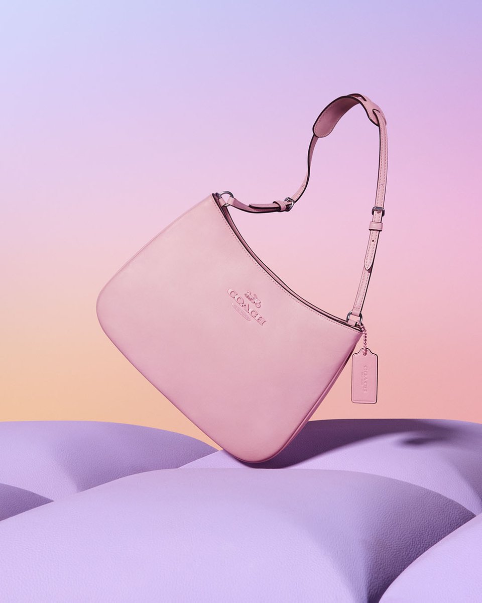 A little pop of spring for your feed, courtesy of the Penelope shoulder bag. 💜🩷 Find your courage. This season, travel through virtual worlds with #imma as she discovers the #CourageToBeReal. on.coach.com/FYCOutlet #CoachOutlet