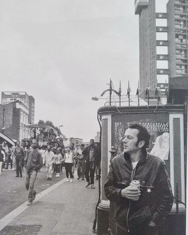 Joe Strummer watching the Notting Hill Carnival on the Golborne Road. Photo: Josh Cheuse