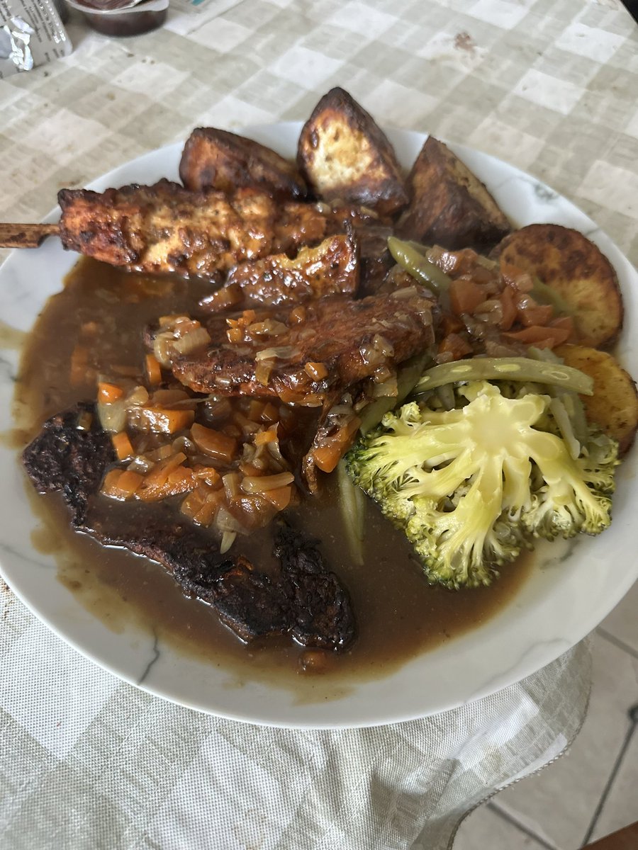 Sunday dinner 
Roast pork & potatoes.  Chicken skewer. Broccoli & green beans.  Gravy with diced carrots & onions.  

#cooking #sundaydinner