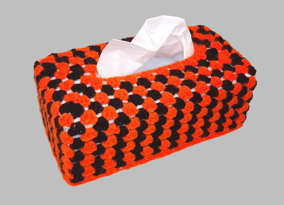 Tissue box cover in bright orange and black. Perfect for Halloween or the Autumn. #halloween #tissueboxcover #crochetboxcover #orange #handmadeincornwall #newonfolksy folksy.com/items/8174214-…