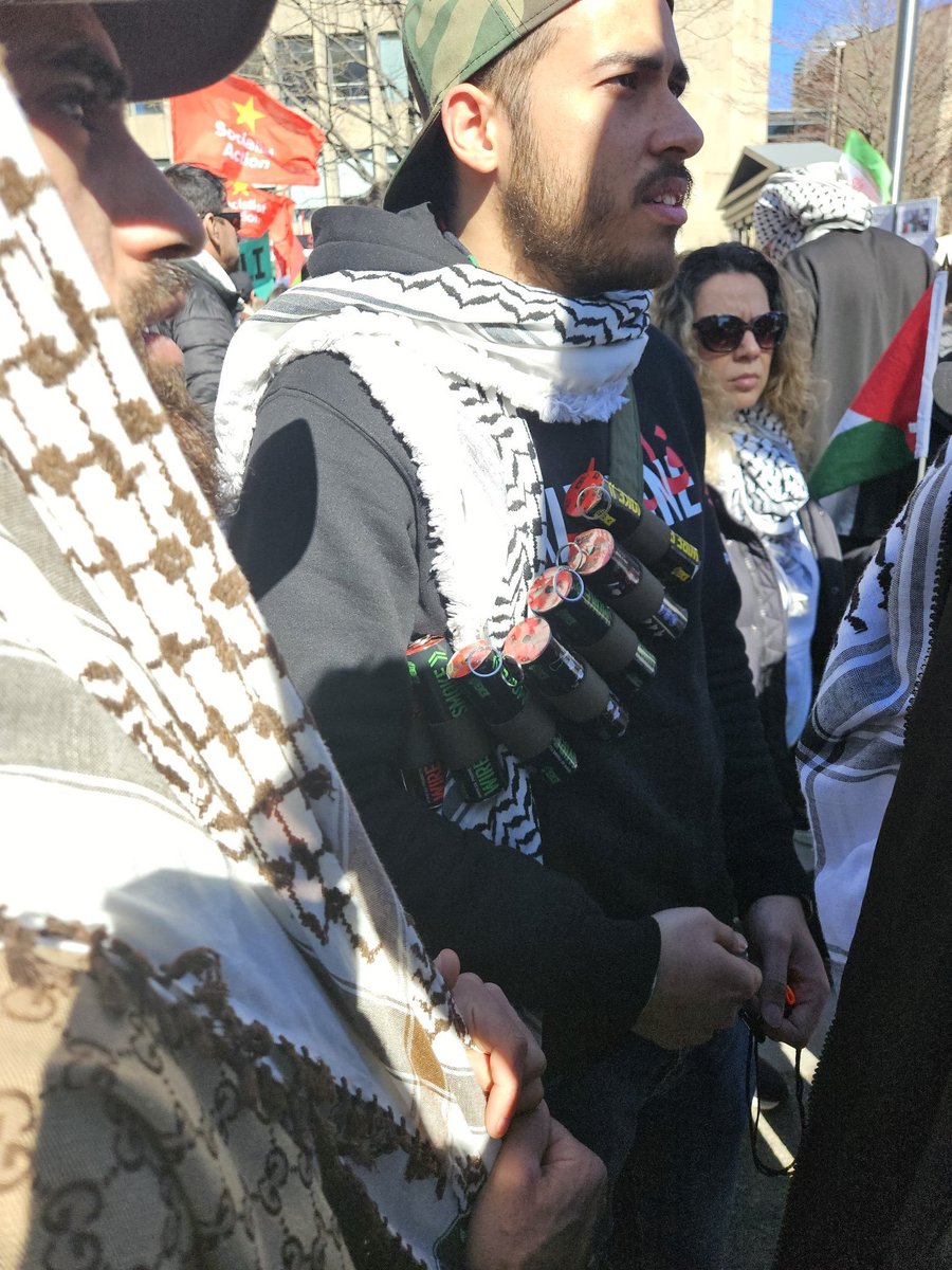 On April 6, extremist Muslims in cities across the world gathered for #AlQudsDay, an Iranian day of rage for Palestine. One of the protesters in Toronto, identified as  Ahmad Jarrer, was photographed wearing a mock suicide bomb prop.