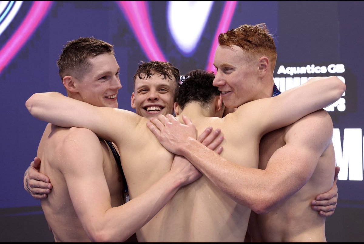That picture tells a story friends, rivals, competitors but most of all humanity.. what a 4 x 200 free team ! Love you Guys Xx