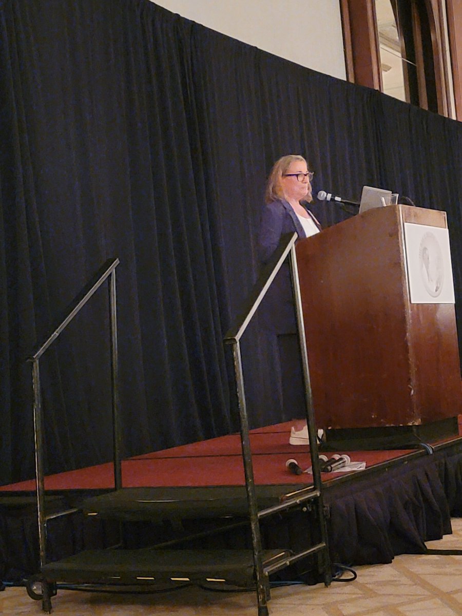 Dr. Andie Asnes, secretary of the Society, at the annual meeting