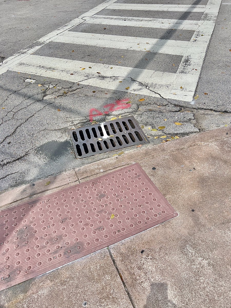 You don’t put storm drain grates in front of a curb ramp. Engineers, planners, public works folk know this a month out of school. Yet #CoralGables —aka The City Beautiful — is littered with these poor placements that are highly dangerous to #wheelchairusers 
#disabilityinclusion