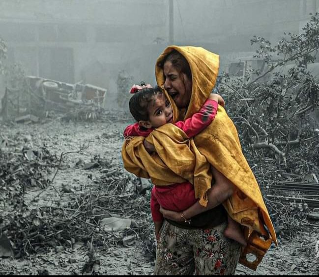 A woman carrying a girl through the destruction in the Ridwan neighborhood after Israeli airstrikes hit Gaza City on October 23rd, 2023.

#gaza #palestine 
#everydaymiddleeast 
#everydayeverywhere