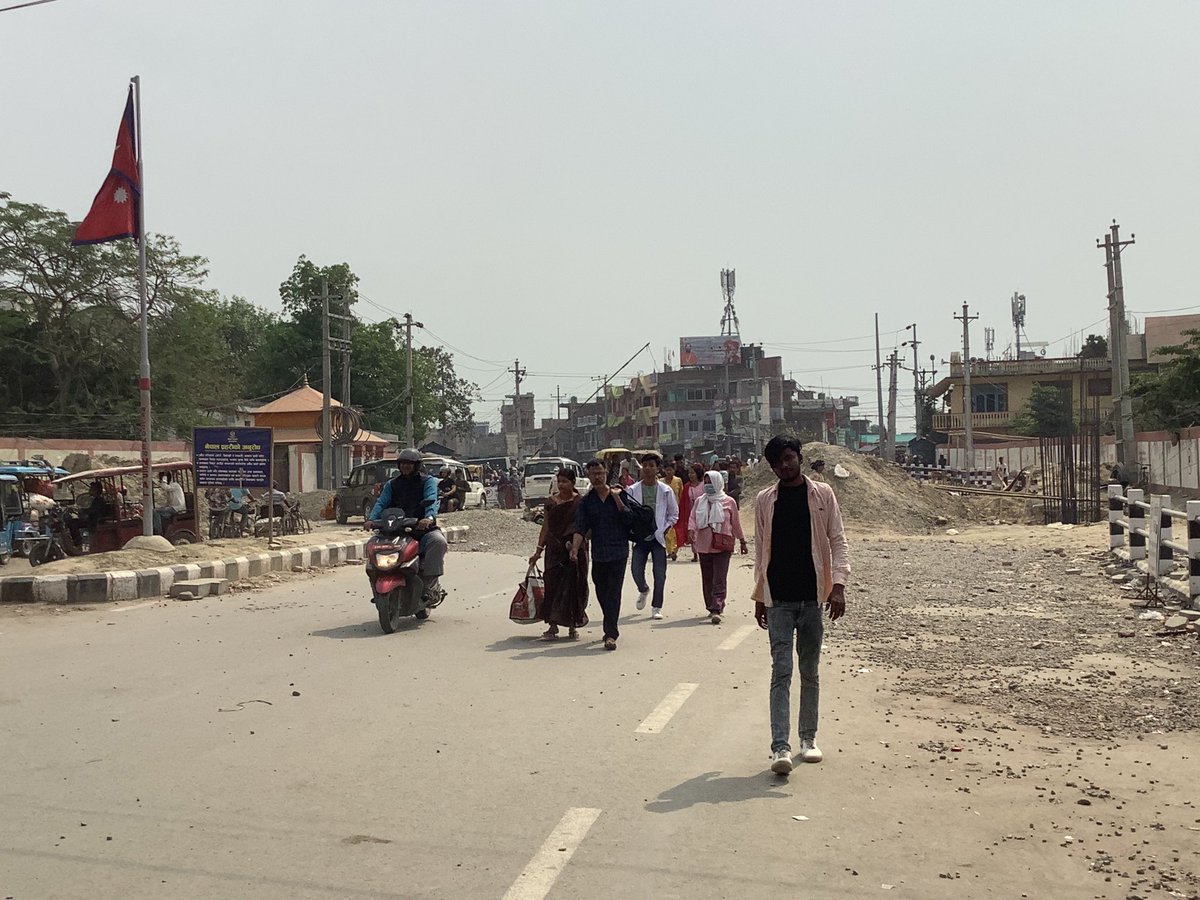 At Biratnagar, in Nepal, at the Nepal-India border, with Jogbani in the Indian state of Bihar over my shoulder. A border that sees thousands of Nepalis & Indians crossing both ways each day for work (& shopping) with no official intervention by the border guards of either country