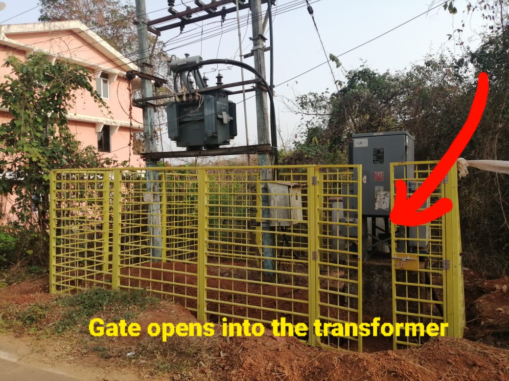spideyrock68's tweet photo. Remarkable planning by Goa Electricity department in Corlim, behind Moonlight Apartment  and gates have 6 inches between two after closure https://t.co/hDzFL8qqvP