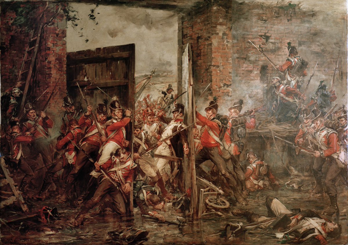 ‘Closing the Gates at Hougoumont’ by Robert Gibb (1903). The Coldstream Guards at Waterloo in 1815