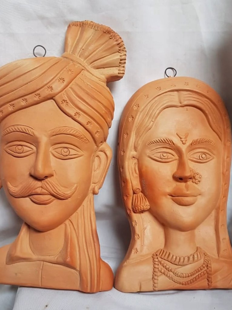 'Clay is a very interesting and fundamental material: it's earth, it's water, & - with fire - it becomes life.' - Rithy Panh Terracotta wall hanging of Rajasthani couple by Nivita. #art #artist #homedecor #handmade #quote #interiordesign #IncredibleIndia #handmade #craft #nft