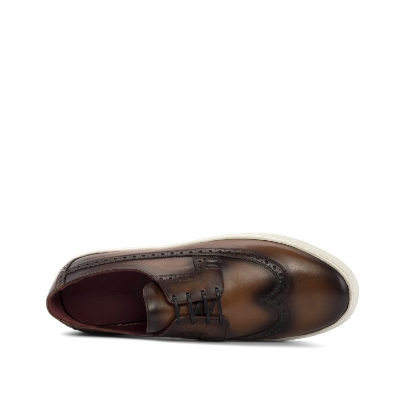 The Burnished Brown Kickabout Longwing offers versatile elegance, seamlessly transitioning between formal attire and casual play.  Buy or Design today at  shopAlexanderNoel.com