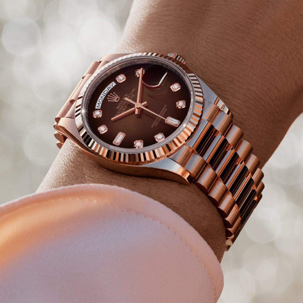 The ultimate watch of prestige. The @Rolex Day-Date 36 in 18 ct Everose gold, 36 mm case, brown ombré dial set with diamonds, President bracelet. #Rolex #DayDate #OfficialRolexRetailer