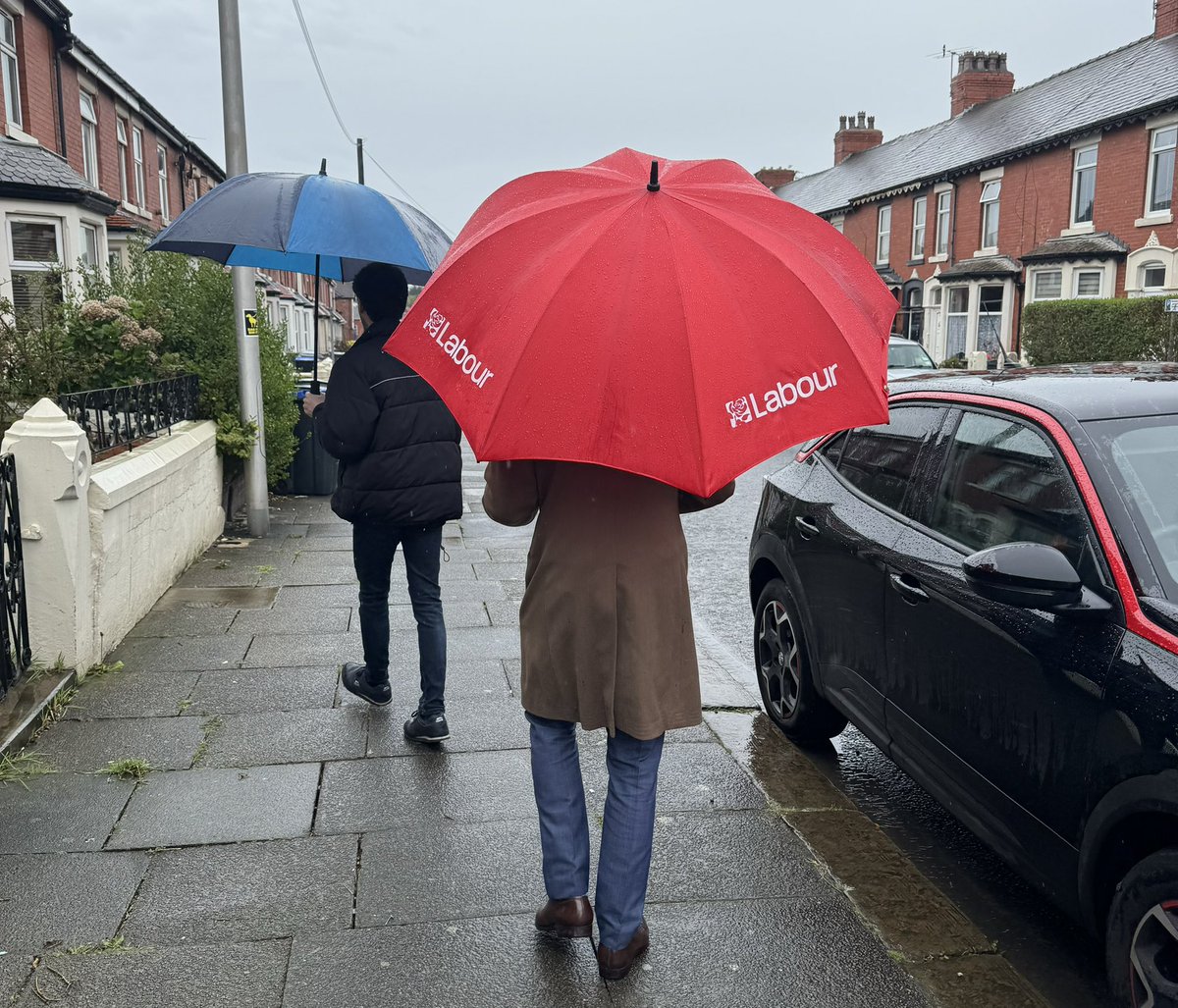 A rainy day by the seaside for @ChrisPWebb in Blackpool with @WStone4SN - pleased to report that all the cute dogs are voting Labour!