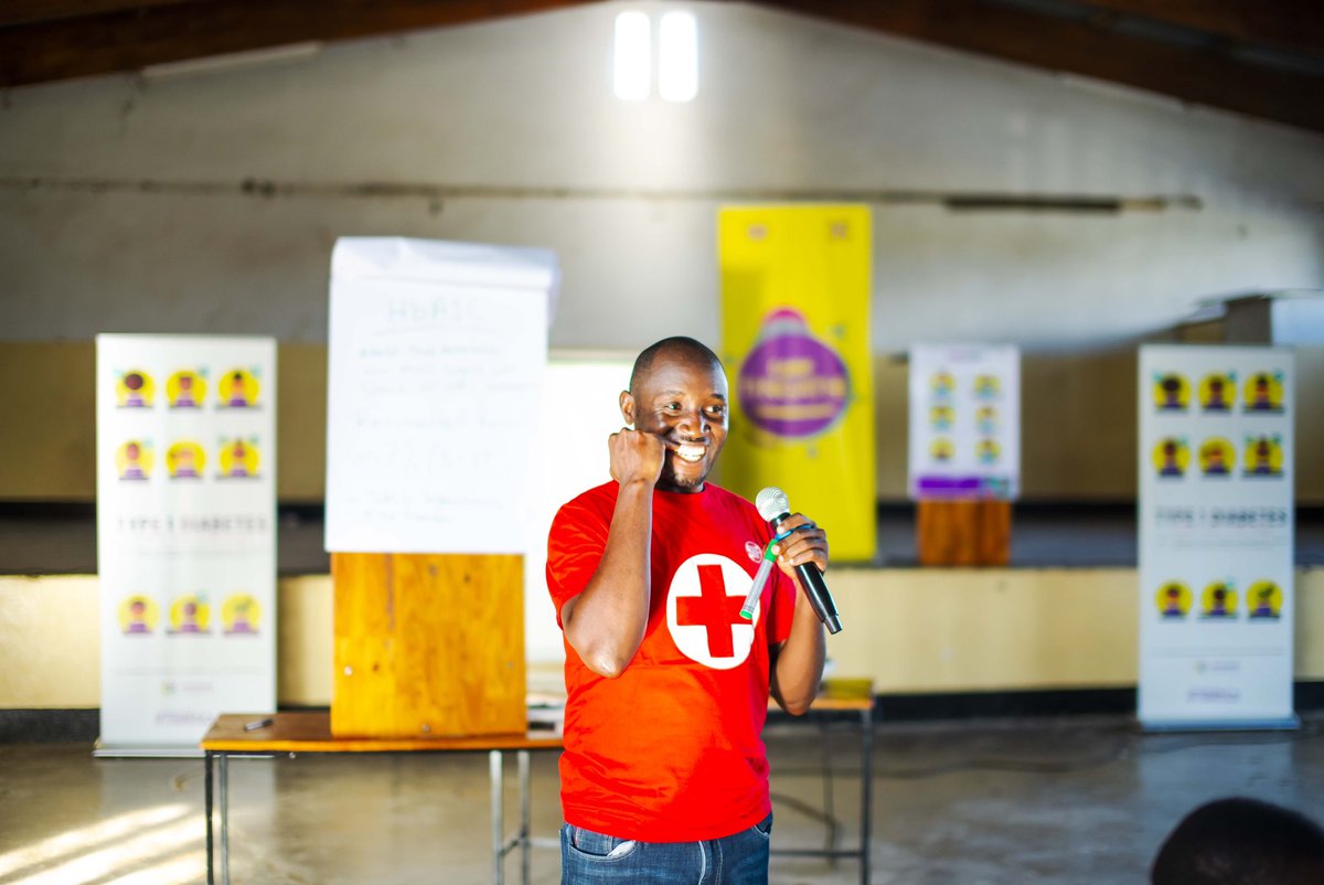 TYPE 1 DIABETES ACROSS BORDERS. Ugandan Nurse, Michael Mugoya, takes the stage in Malawi, sharing his insights at Camp Tingathe.  Sharing knowledge among countries of similar histories &  socioeconomic contexts is important. Together, we learn & grow 💜 #T1DAfrica cc: @PIH