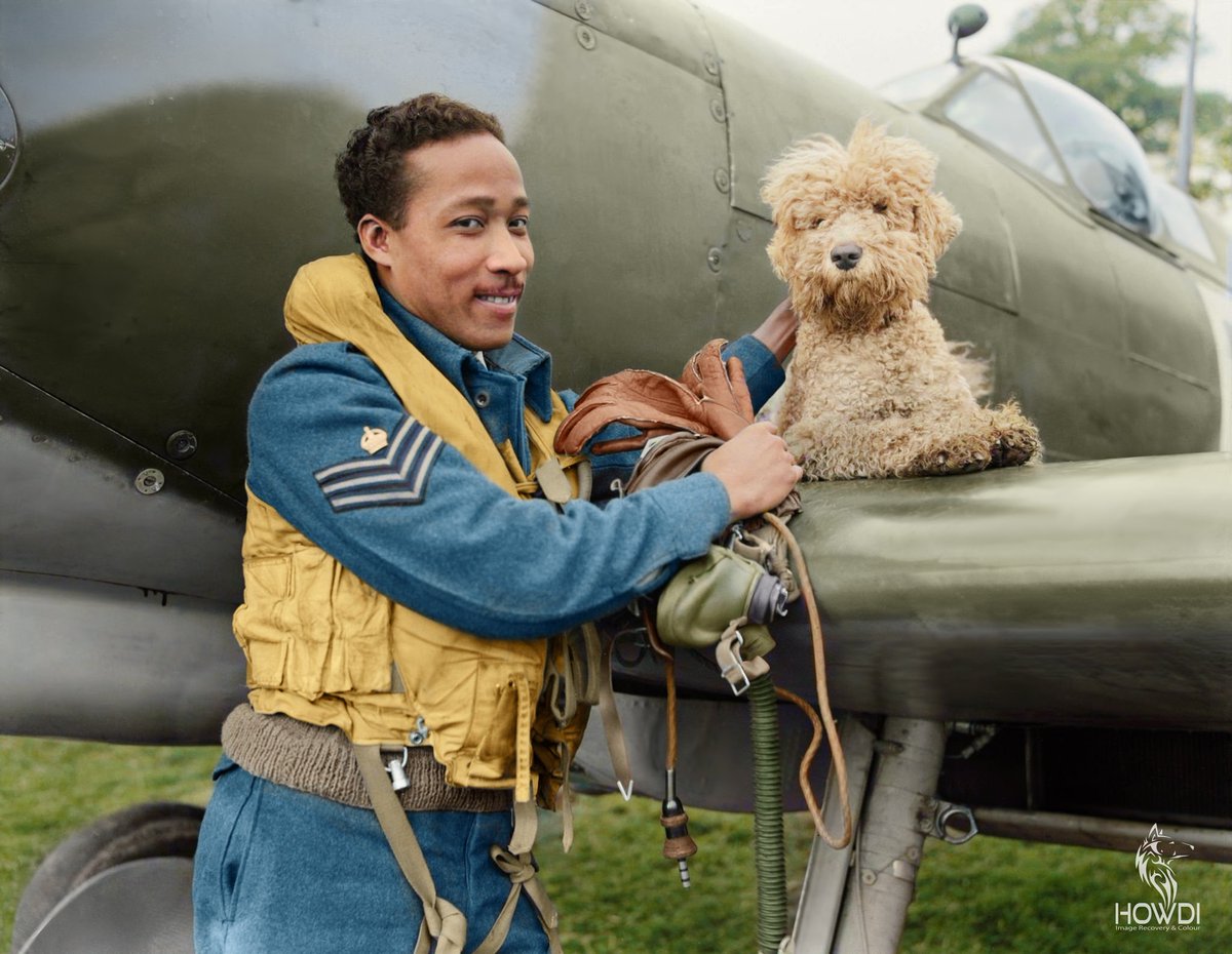 F/Sgt James Hyde of San Juan, Trinidad, a Spitfire pilot who arrived in Britain in 1942 to begin his training, here pictured in 1944 with his Squadron's mascot, a dog called 'Dingo'.

Image Repair & Colourisation - Nathan Howland @ HowdiColourWorks