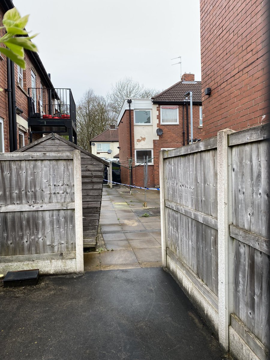 An alleyway behind some of the homes in Woodhall Crescent is also cordoned off this afternoon @MENnewsdesk