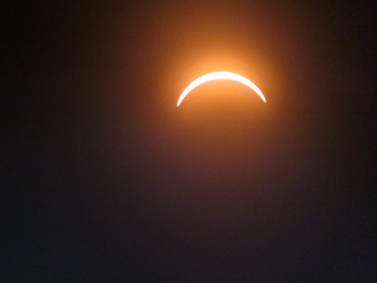 johnage's tweet image. My humble attempts at trying to catch the solar eclipse from Montréal. We were lucky enough that from our backyard, we were in the path of totality. Such a surreal, and beautiful moment.