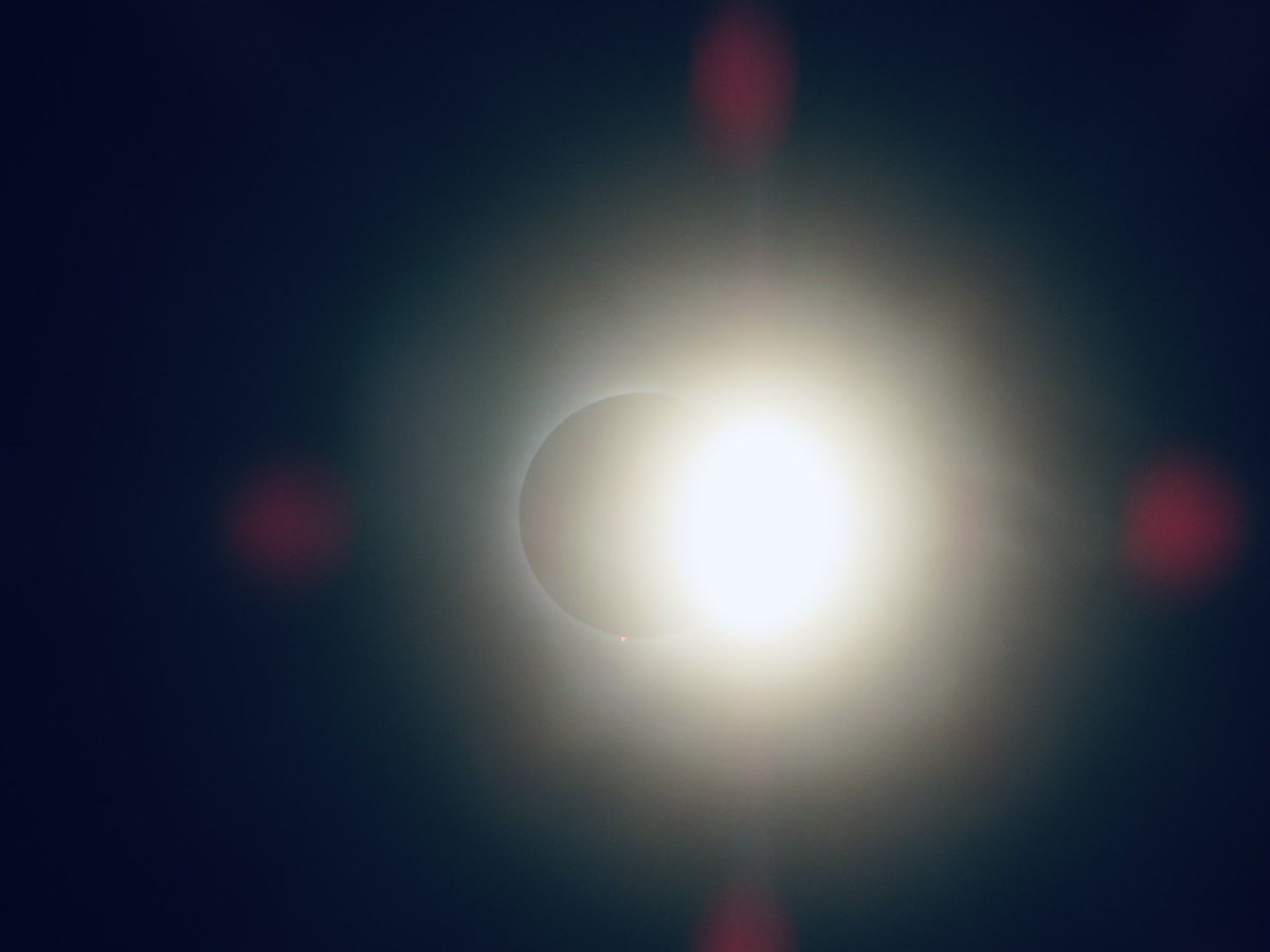 johnage's tweet image. My humble attempts at trying to catch the solar eclipse from Montréal. We were lucky enough that from our backyard, we were in the path of totality. Such a surreal, and beautiful moment.