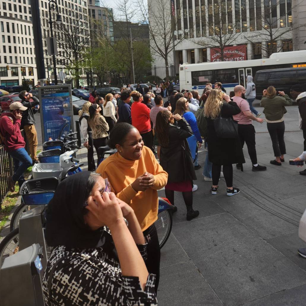 Brooklyn Law School professors and students walked to the crowded plaza to get a better look at the eclipse this afternoon.