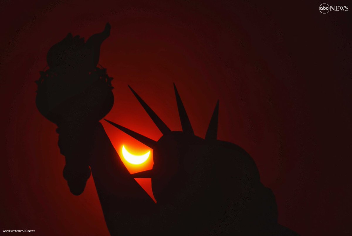 The city that never sleeps, as seen during Monday's solar eclipse. The solar eclipse was captured high above the Statue of Liberty in New York City. Follow along for live updates and photos from the eclipse: trib.al/zE45GAZ