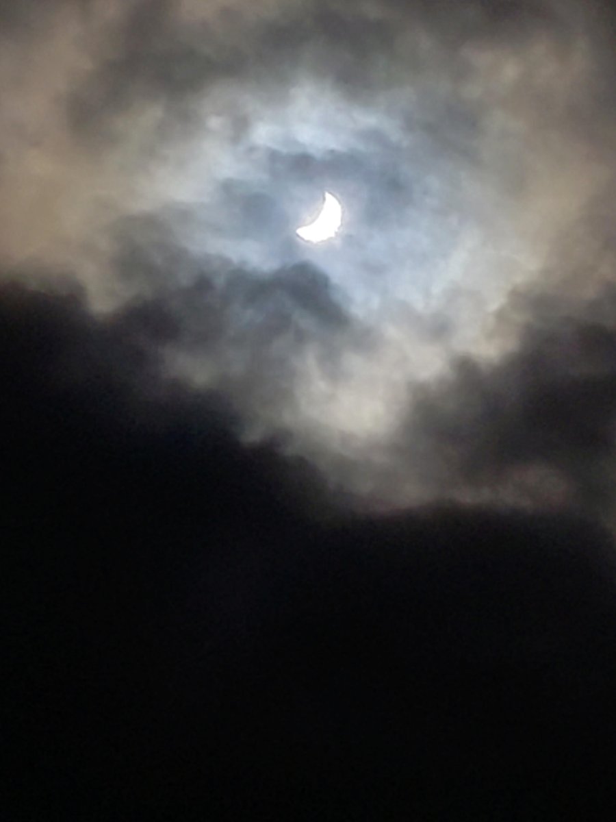 I used the phone to take a few photos and videos of the eclipse and view it safely without looking directly at it. It was pretty cool! What a neat experience! (These photos were taken with a darker setting than what it looked like outside, so I could capture the sun). 3/3