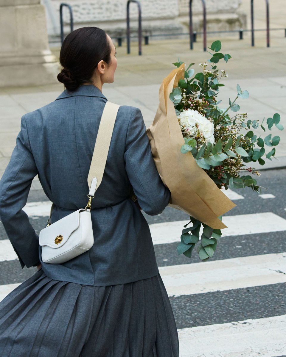 The only thing better than flowers: Handbags. Specifically, our Heirloom Place cross body bag in grained leather.