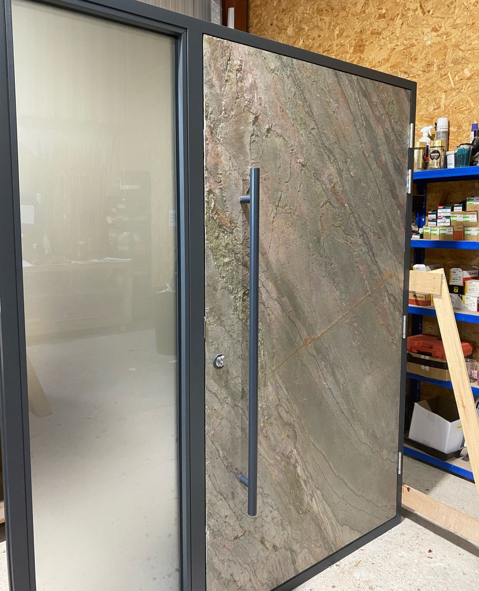 Check out our latest work: A Slate Stone Finish #Entrance #Door, ready to leave our workshop. It's durable, elegant, and makes a bold statement at any entryway. Proudly crafted by our expert #joinery team, it's designed to impress and built to last. camelglass.co.uk/doors/inspirat…