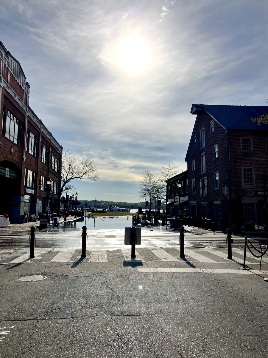 HobanGirl's tweet photo. Staying indoors for the eclipse, livestream feed on the laptop, but was out at dawn, caught early Annunciation Mass at St Mary’s, then the kids filed in for theirs. Upper #KingSt and lower, still puddles from tidal spillover. Lord, love having #OldTown #Alexandria to myself. 🤍🌅 https://t.co/zwKyKrCJBG