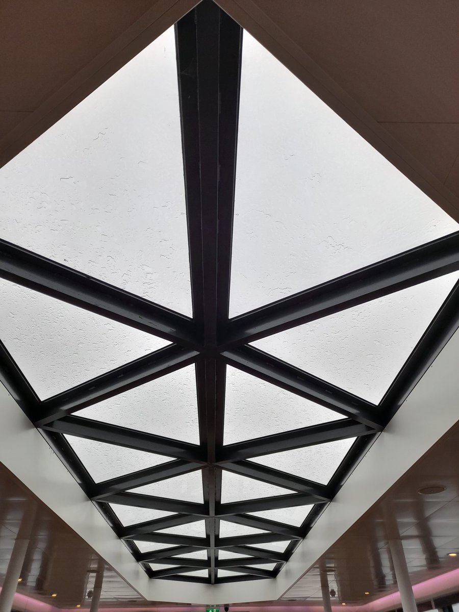 Not quite to your level of challenge @Cshearer41... The glass viewing roof is made from congruent triangles with side length 1.6 metres. What was the minimum area of glass needed to cut the glass panes from? #geometry