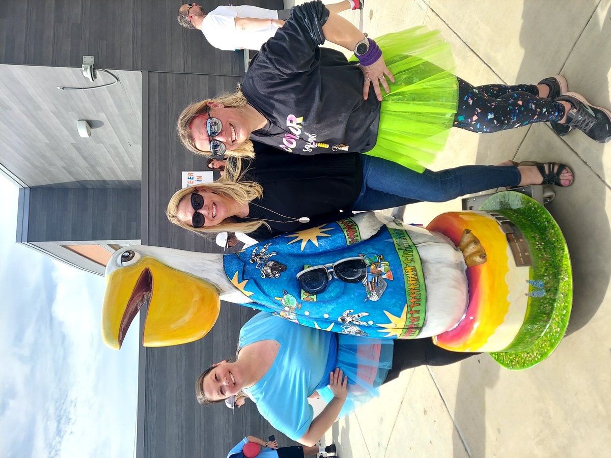 Artist and PTA sponsors with "Higgy," named in honor of Edward Higgins White II. Our art teacher, Mrs. Asiala (Center), created &amp; painted the design, featuring a Hawaian shirt pattern of Ed White's space walk and the elevations of both the old and new schools. Students love it!