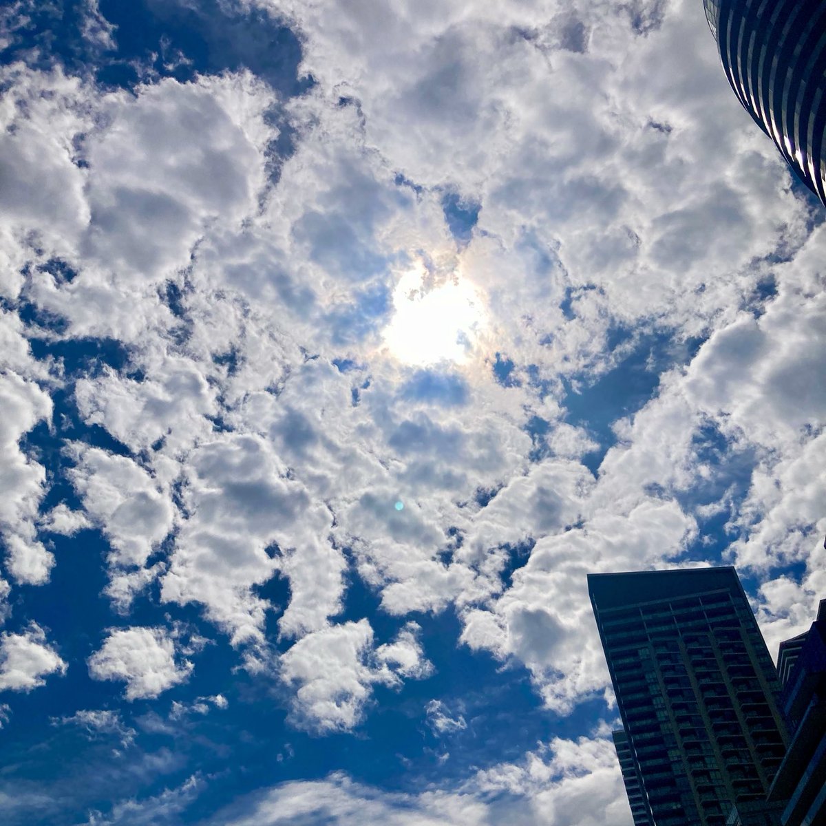 CLOUDS ARE BREAKING UP over Toronto as #Eclipse event nears.