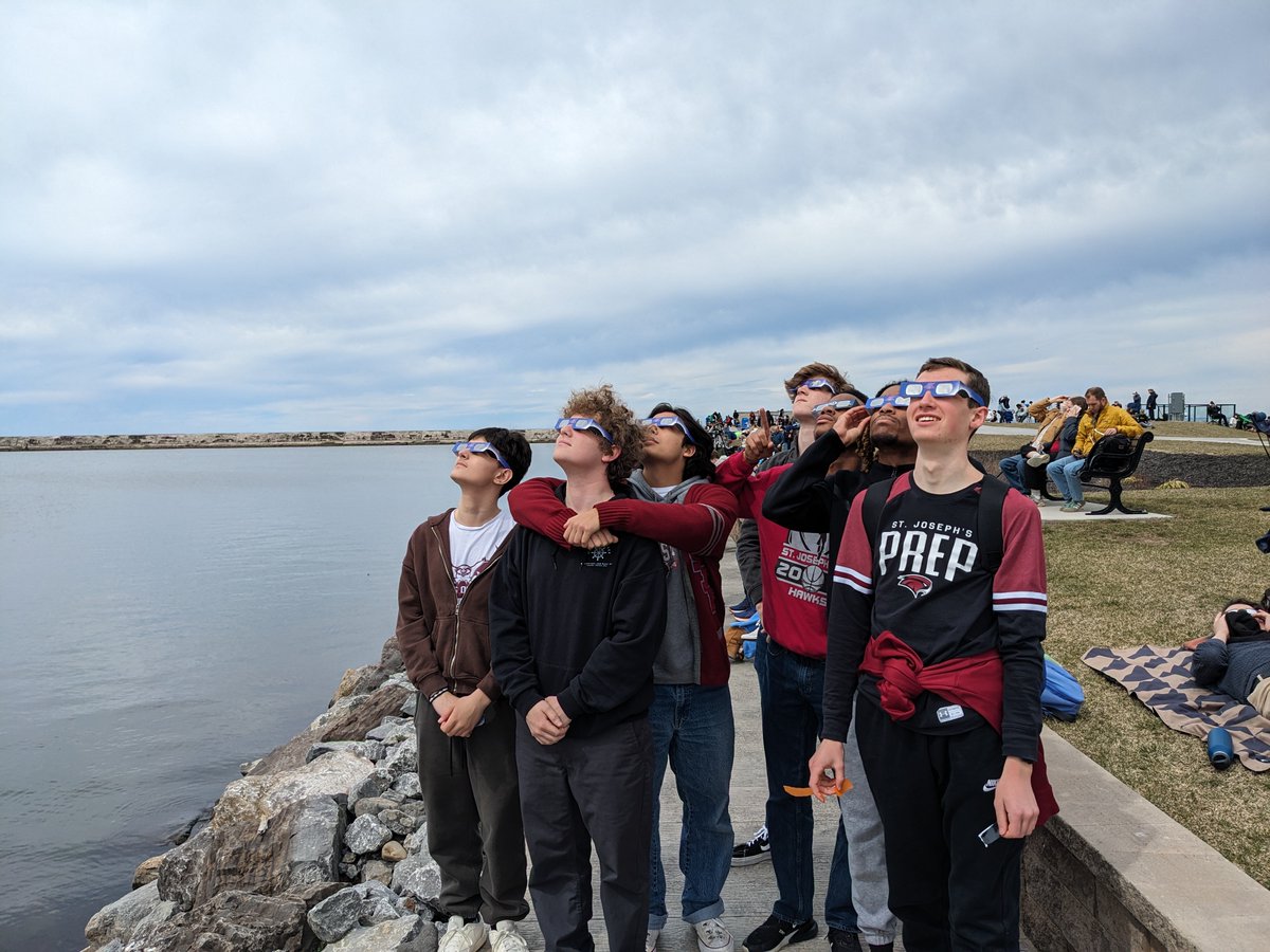 Science Teachers Dr. Geoff Nunes, Kristin Ashcom, and Kathleen Hennessey brought a large group of Prep Hawks to Oswego, NY, the closest site from the Prep to the 'path of totality' for today's solar eclipse. #SolarEclipse2024