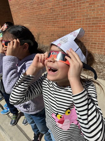 The solar eclipse is in progress and Mrs. Latek's Wescott 1st-graders are already checking out the celestial spectacle! ☀️🌑 Stay tuned to see more of how D30 students are celebrating this rare event! #d30learns