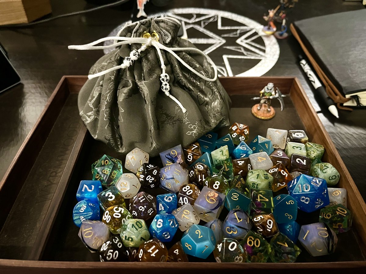 Take a closer look at Cyrus' dice and dice bag, carefully collected by the groups resident dice dragon

#dungeonsanddivergents #dnd #dnd5e #dungeonsanddragons5e #neurodivergent #ttrpg #dnddice #d20 #dndgroup #livestream #twitch #twitchstreamer #dnddice #dnddicebags #dicegoblin