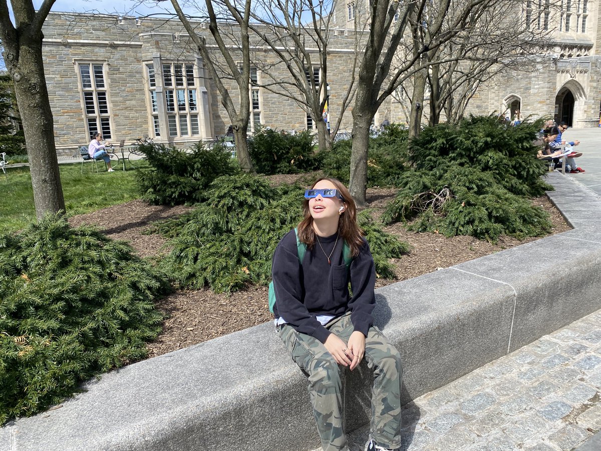 Laura Rivas ‘26, a @Princeton electrical and computer engineering student, takes in the sights up in the sky by Firestone Library during #Eclipse2024.