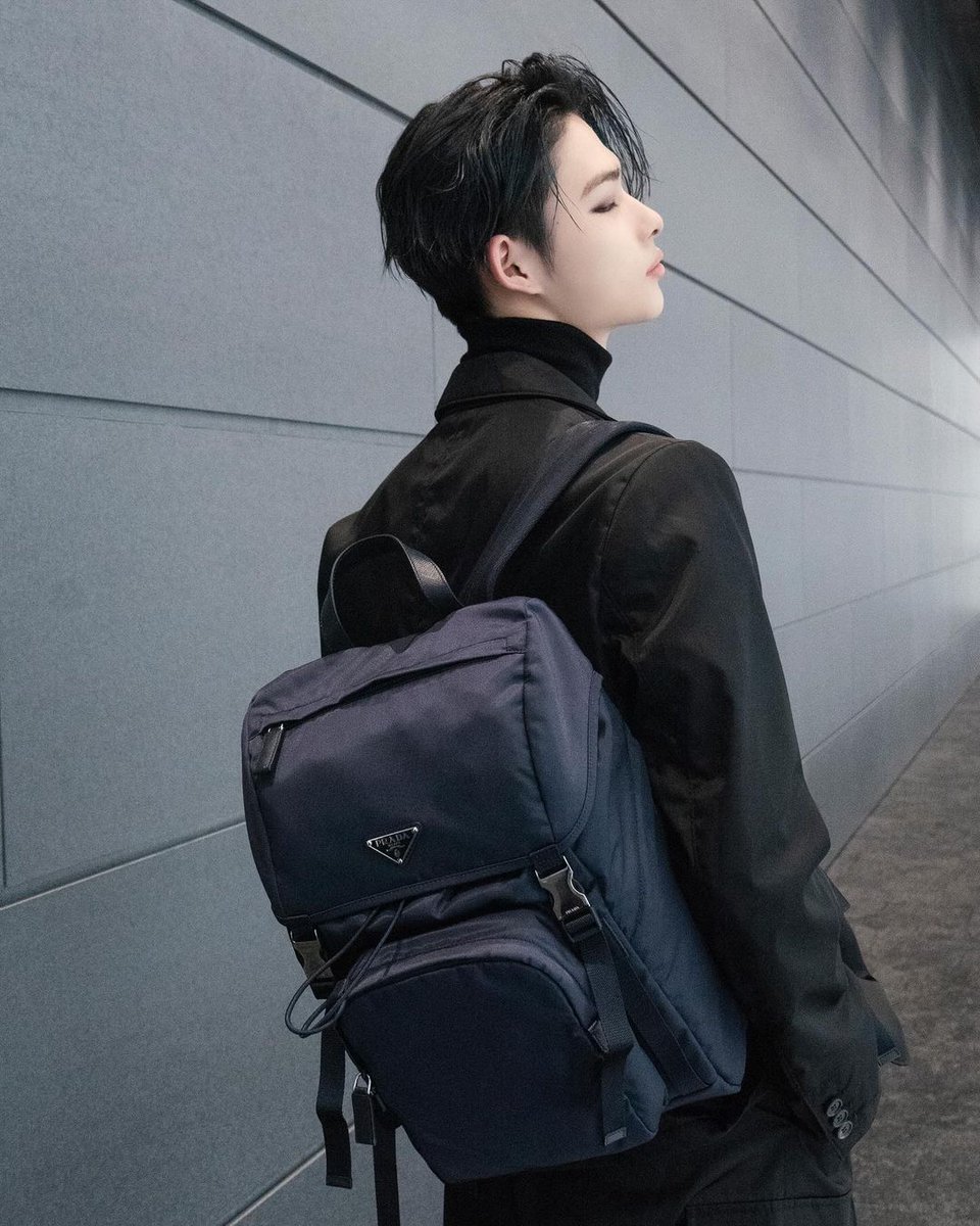 Sharing a post while wearing this new navy blue bag. The touch of black attire adds a classy and sophisticated feel, enhancing the value of this photo.
