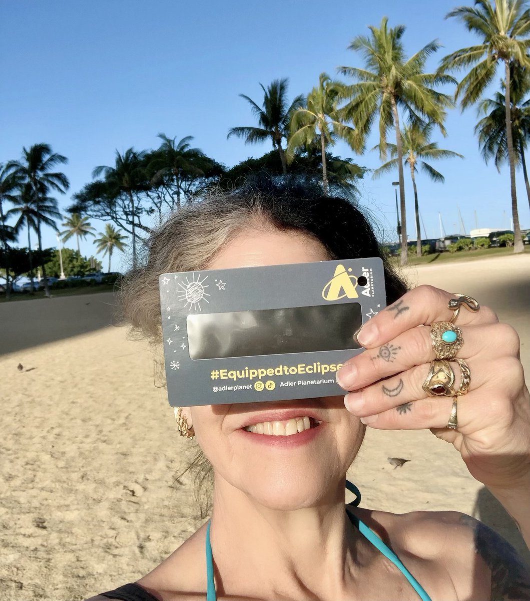 Watching the eclipse at daybreak on Waikiki Beach