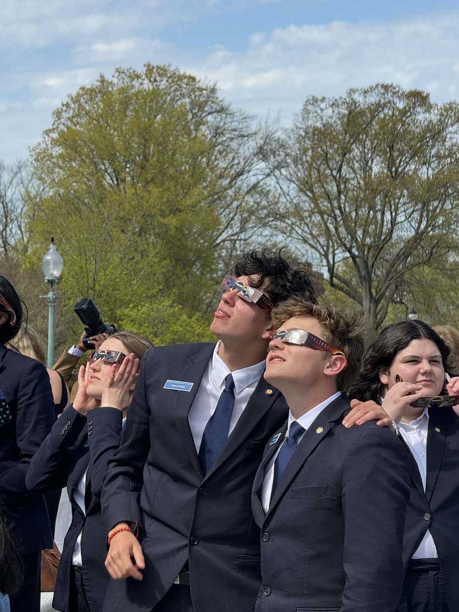 Pure joy on Senate steps as pages gather to watch the eclipse