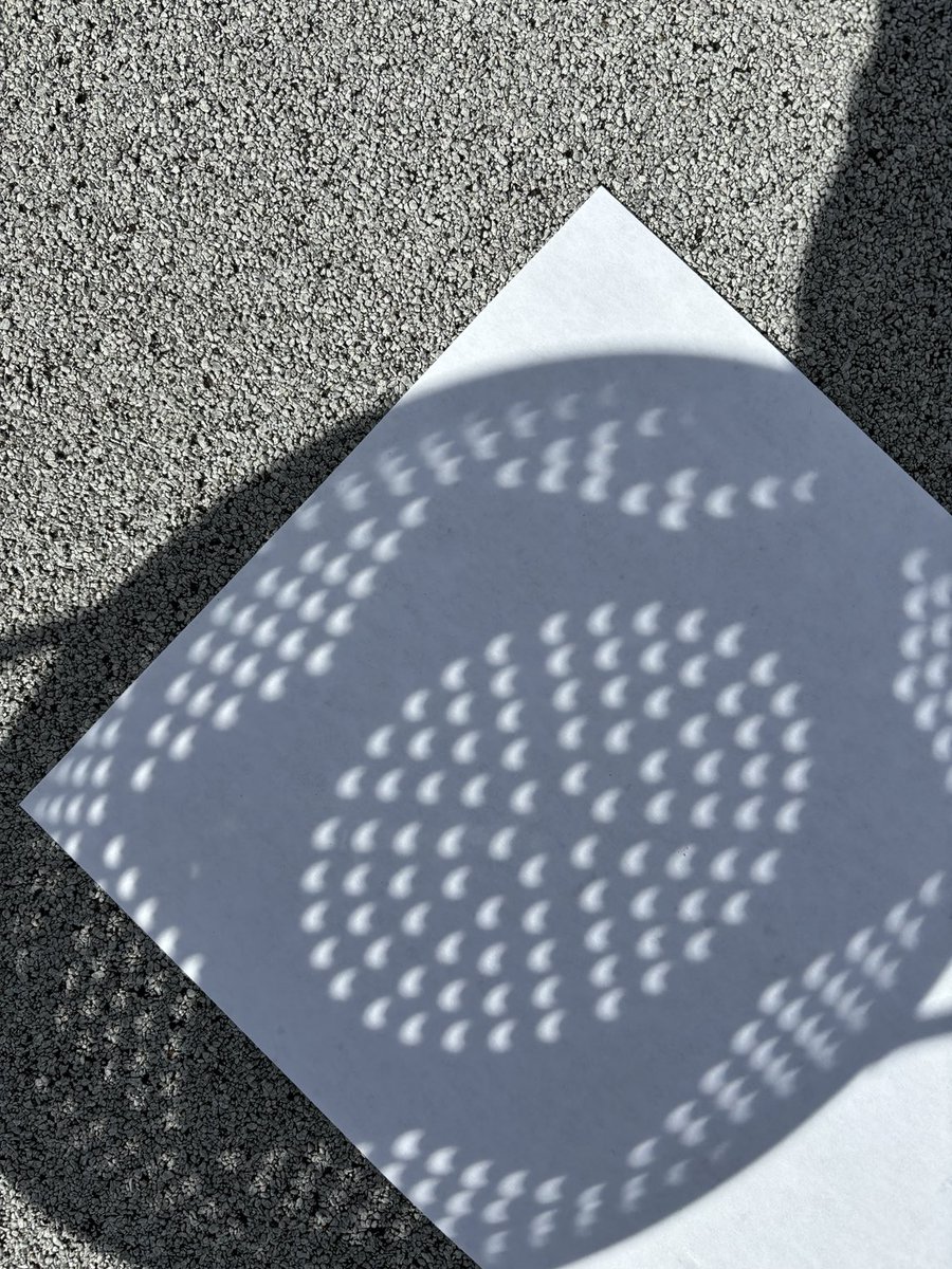 Tons of individual moon shadows as seen through a colander